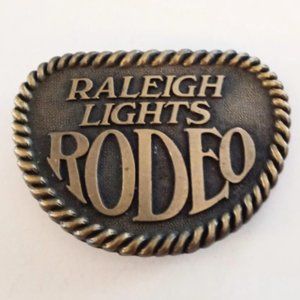 Metal Belt Buckle Says Raleigh Lights Rodeo Fashion Accessories Collectible